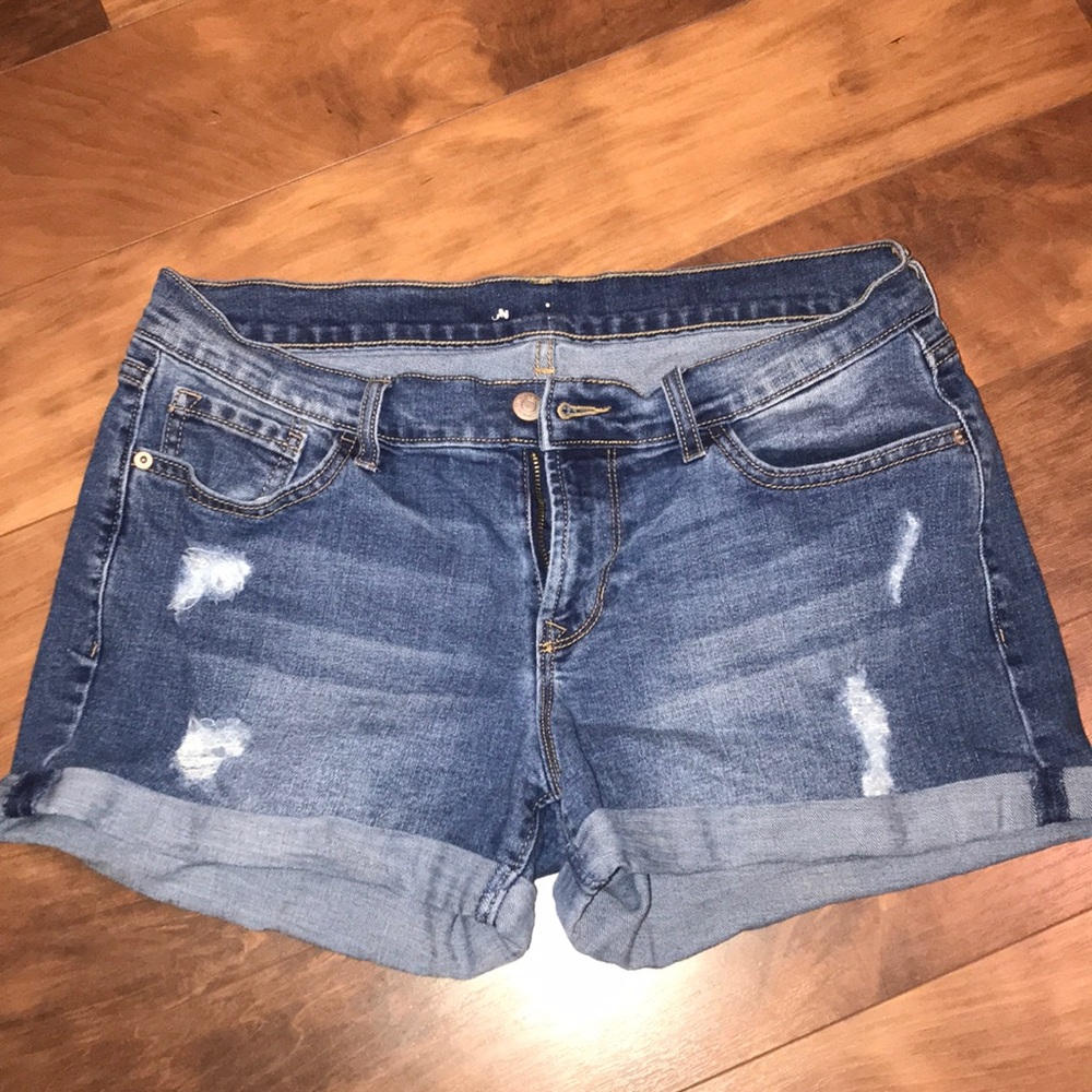 Distressed blue jean shorts
